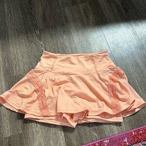 Peachy orange color free people movement athletic skirt